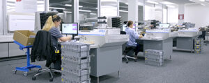 Open office area with workers using OPEX system in digital workplace